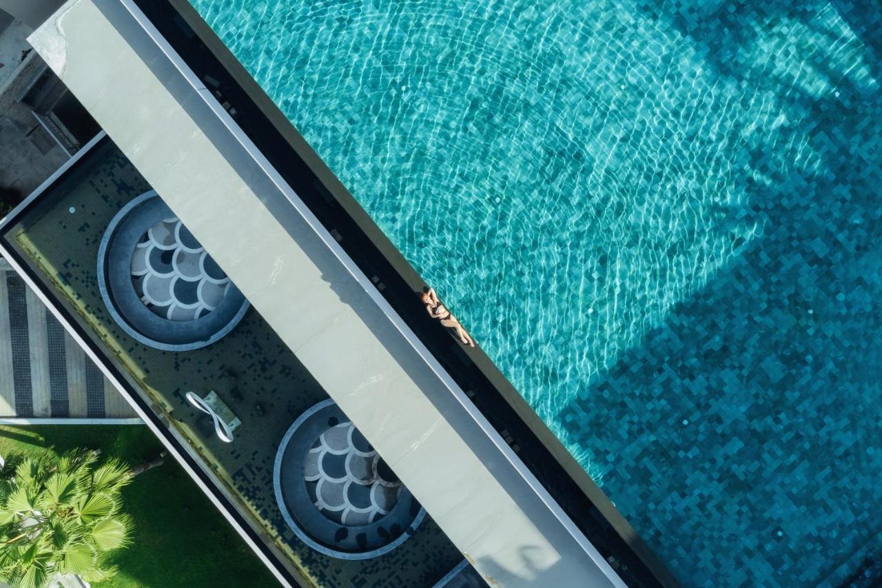 Oceanfront Beach Resort - Sha Extra Plus Patong Exteriör bild A pool with a swim jet