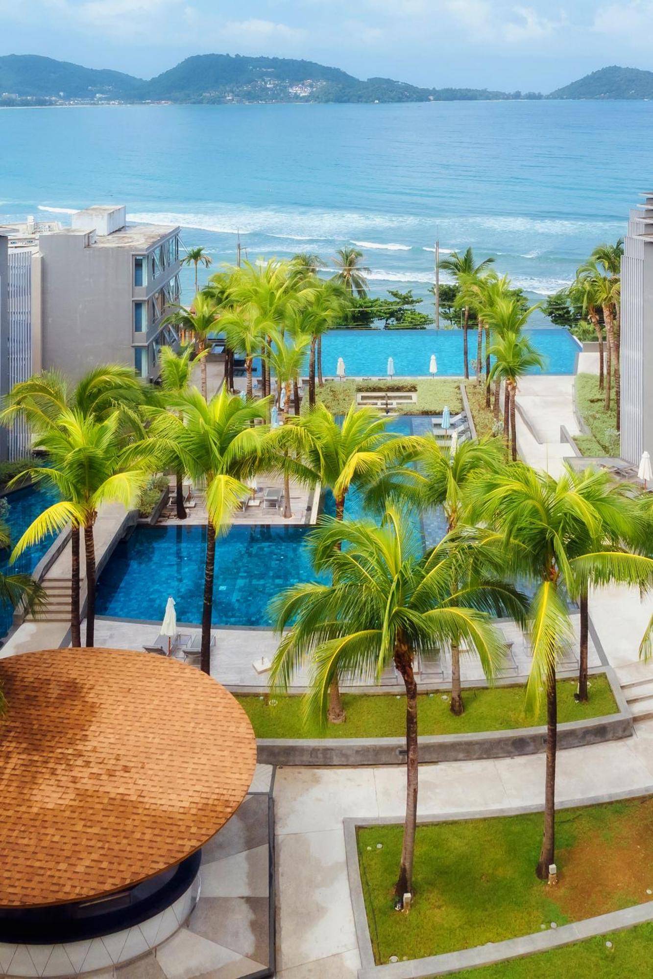 Oceanfront Beach Resort - Sha Extra Plus Patong Exteriör bild The swimming pool at the resort